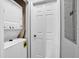 This closet includes stacked washer and dryer with door and electrical panel at 3214 Calabria Avenue, Davenport, FL 33897