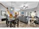 Open living space with stairs, wood floors, and access to the kitchen at 3214 Calabria Avenue, Davenport, FL 33897