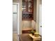 Wet bar with wine storage, tile backsplash, and dark wood cabinets at 3307 Kentshire Blvd, Ocoee, FL 34761