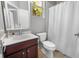 Bathroom featuring a vanity with a dark wood cabinet, along with a toilet and shower at 3307 Kentshire Blvd, Ocoee, FL 34761