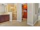 Bathroom featuring a glass-enclosed shower and tile flooring, leading to a walk-in closet at 3307 Kentshire Blvd, Ocoee, FL 34761