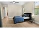 Spacious bedroom features wood flooring, a ceiling fan, an accent wall, and lots of natural light at 3307 Kentshire Blvd, Ocoee, FL 34761