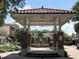 Outdoor gazebo with classic brick pillars and tile roof, surrounded by lush greenery and landscaping at 3307 Kentshire Blvd, Ocoee, FL 34761