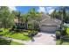 Beautiful single-Gathering home with a manicured lawn, mature trees, and a paver driveway at 3307 Kentshire Blvd, Ocoee, FL 34761