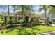 Beautiful home with an arched entry, well-maintained lawn, manicured landscaping, and two car garage at 3307 Kentshire Blvd, Ocoee, FL 34761