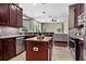 Bright kitchen boasts an island, stainless steel appliances, and a seamless flow to the living area at 3307 Kentshire Blvd, Ocoee, FL 34761