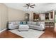 Open living room with contemporary decor and seamless flow to kitchen and bar area at 3307 Kentshire Blvd, Ocoee, FL 34761