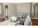 Spacious living room showcasing a comfortable gray sectional sofa and ottoman on top of a white rug at 3307 Kentshire Blvd, Ocoee, FL 34761