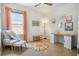 Bright home office with natural light, a modern desk, chair, and a comfortable sitting area at 3307 Kentshire Blvd, Ocoee, FL 34761