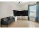 Office featuring a sleek desk and workstation setup, complemented by a comfortable sofa at 3307 Kentshire Blvd, Ocoee, FL 34761