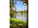 Scenic view of a tranquil pond with a fountain surrounded by lush greenery, creating a peaceful atmosphere at 3307 Kentshire Blvd, Ocoee, FL 34761