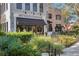 A charming outdoor area of a restaurant featuring a black awning with the restaurant's name and a brick facade at 3307 Kentshire Blvd, Ocoee, FL 34761