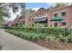 Charming brick building with a CRAFT sign, part of a lively street featuring outdoor seating and greenery at 3307 Kentshire Blvd, Ocoee, FL 34761