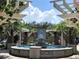 Beautiful fountain with a pergola and colorful mosaic tiles, creating a centerpiece for the town square at 3307 Kentshire Blvd, Ocoee, FL 34761