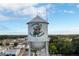 A 'Welcome to Winter Garden' water tower set against a sunny sky surrounded by lush, green foliage at 3307 Kentshire Blvd, Ocoee, FL 34761