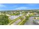 Community aerial view shows pond, landscaping, and neighborhood streets at 3824 Blue Dasher Dr, Kissimmee, FL 34744