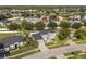 Aerial view of the house in neighborhood near lake and mature trees at 3824 Blue Dasher Dr, Kissimmee, FL 34744