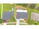 Aerial view of property featuring a screened-in pool and well-manicured lawn at 3824 Blue Dasher Dr, Kissimmee, FL 34744