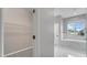 Elegant bathroom with tiled floors and soaking tub next to a walk-in closet for storage, ideal for relaxation at 3824 Blue Dasher Dr, Kissimmee, FL 34744