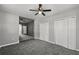 Bedroom features gray walls, carpet, and closets at 3824 Blue Dasher Dr, Kissimmee, FL 34744