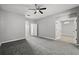 Spacious bedroom featuring gray walls, carpet, and a ceiling fan at 3824 Blue Dasher Dr, Kissimmee, FL 34744