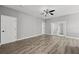 Bedroom featuring stylish wood floors and a ceiling fan at 3824 Blue Dasher Dr, Kissimmee, FL 34744