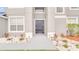 Inviting front entrance with decorative landscaping and a modern door at 3824 Blue Dasher Dr, Kissimmee, FL 34744