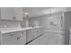 Updated kitchen featuring quartz countertops and stainless steel appliances at 3824 Blue Dasher Dr, Kissimmee, FL 34744