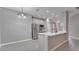Modern kitchen with stainless steel appliances and a breakfast bar at 3824 Blue Dasher Dr, Kissimmee, FL 34744