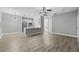 Open living area with luxury vinyl flooring leading into the kitchen at 3824 Blue Dasher Dr, Kissimmee, FL 34744