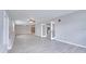 Expansive living room with wood look floors, gray walls, and french doors to another area at 3824 Blue Dasher Dr, Kissimmee, FL 34744
