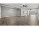 Spacious room with luxury vinyl flooring and multiple ceiling fans at 3824 Blue Dasher Dr, Kissimmee, FL 34744