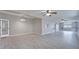 Open-concept living space with wood look floors, bright walls, and view of the backyard at 3824 Blue Dasher Dr, Kissimmee, FL 34744