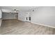 Large living room with luxury vinyl floors and double glass doors at 3824 Blue Dasher Dr, Kissimmee, FL 34744