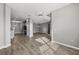 Bright open floor plan with luxury vinyl flooring and pendant lights at 3824 Blue Dasher Dr, Kissimmee, FL 34744