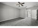 Spacious main bedroom with a ceiling fan and an ensuite bathroom at 3824 Blue Dasher Dr, Kissimmee, FL 34744