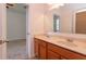 Bathroom showcasing a double sink vanity with granite countertops at 3904 Coastal Breeze Dr, Kissimmee, FL 34744