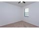 Carpeted bedroom illuminated by a window and a ceiling fan at 3904 Coastal Breeze Dr, Kissimmee, FL 34744