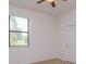 Bright bedroom with carpeted floor, ceiling fan, and window at 3904 Coastal Breeze Dr, Kissimmee, FL 34744