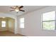 Bright bedroom with neutral walls, plush carpeting, and natural light from two windows at 3904 Coastal Breeze Dr, Kissimmee, FL 34744