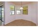 Sunlit breakfast nook with sliding glass doors and three windows overlooking the yard at 3904 Coastal Breeze Dr, Kissimmee, FL 34744