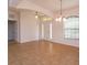 Open-concept living space with tile floors, and natural light at 3904 Coastal Breeze Dr, Kissimmee, FL 34744