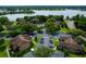 Aerial view of complex near the lake, showcasing well-maintained grounds, and ample parking at 420 Forestway Cir # 206, Altamonte Springs, FL 32701