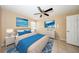 Virtually staged bedroom showcasing a bed, dressers, and blue accents at 420 Forestway Cir # 206, Altamonte Springs, FL 32701
