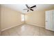 Bright bedroom with tile flooring, ceiling fan, and window for natural light at 420 Forestway Cir # 206, Altamonte Springs, FL 32701
