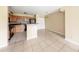Bright kitchen features wood cabinets, black appliances, and opens to the dining area at 420 Forestway Cir # 206, Altamonte Springs, FL 32701