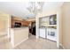 Kitchen adjacent to laundry area, featuring wooden cabinets and black appliances at 420 Forestway Cir # 206, Altamonte Springs, FL 32701