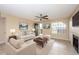 Staged living room with ceiling fan, neutral paint, stylish furnishings, and fireplace at 420 Forestway Cir # 206, Altamonte Springs, FL 32701