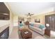 Virtually staged living room featuring a fireplace, sofa, and dining area at 420 Forestway Cir # 206, Altamonte Springs, FL 32701