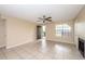 Bright living room with ceiling fan, tile floor, fireplace, and access to balcony at 420 Forestway Cir # 206, Altamonte Springs, FL 32701